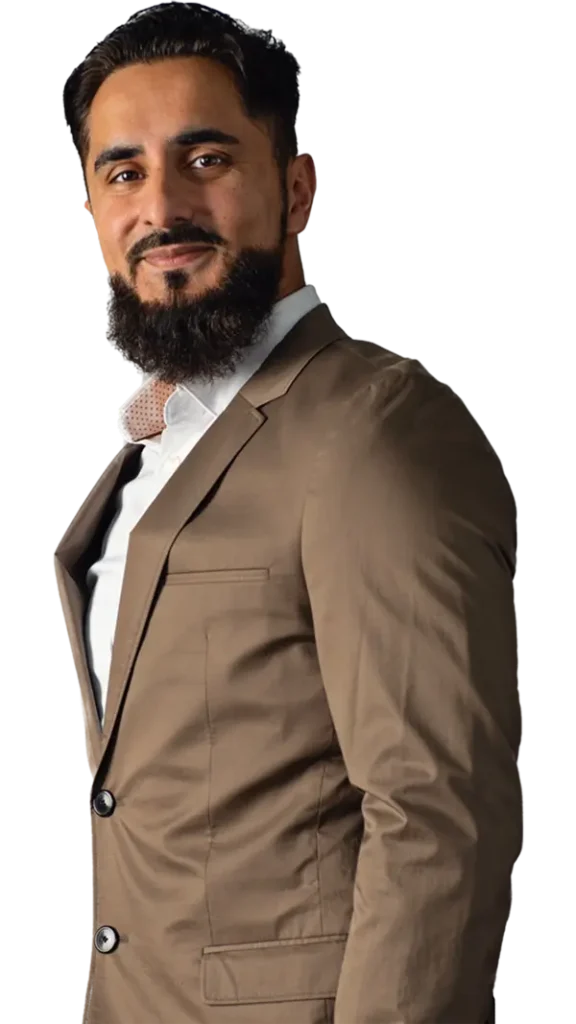 A man sporting a beard, dressed in a formal suit, presenting a polished and sophisticated appearance.